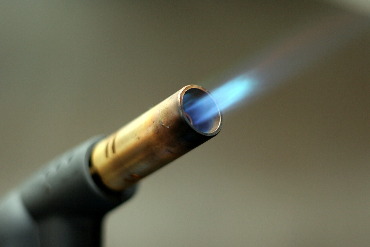Close up view of lit butane torch's flame